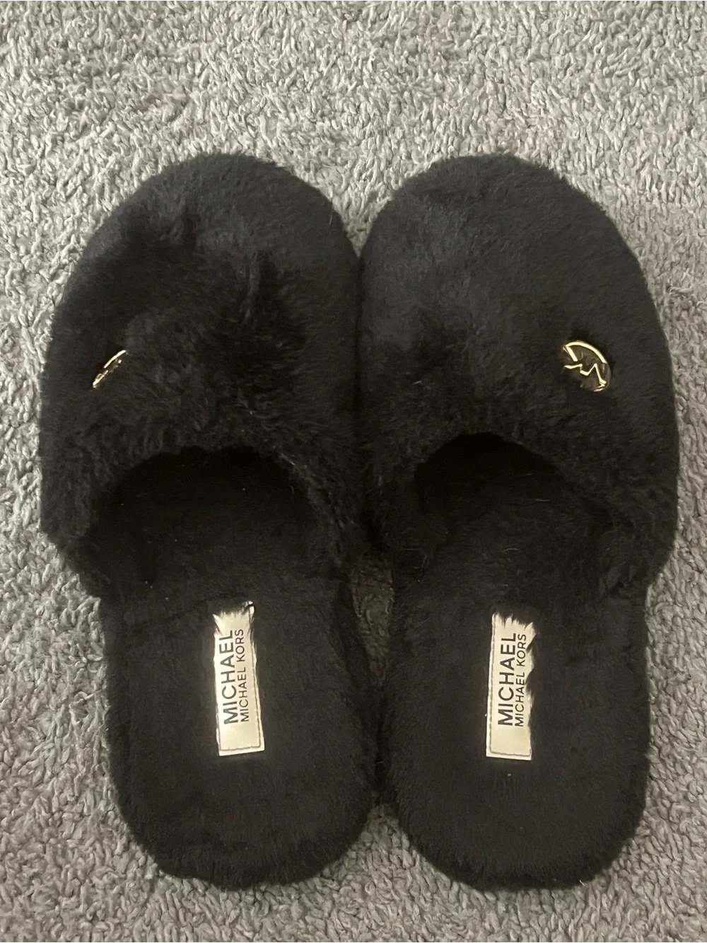Michael Kors Black Faux-Fur Slip-Ons with Gold MK Emblem